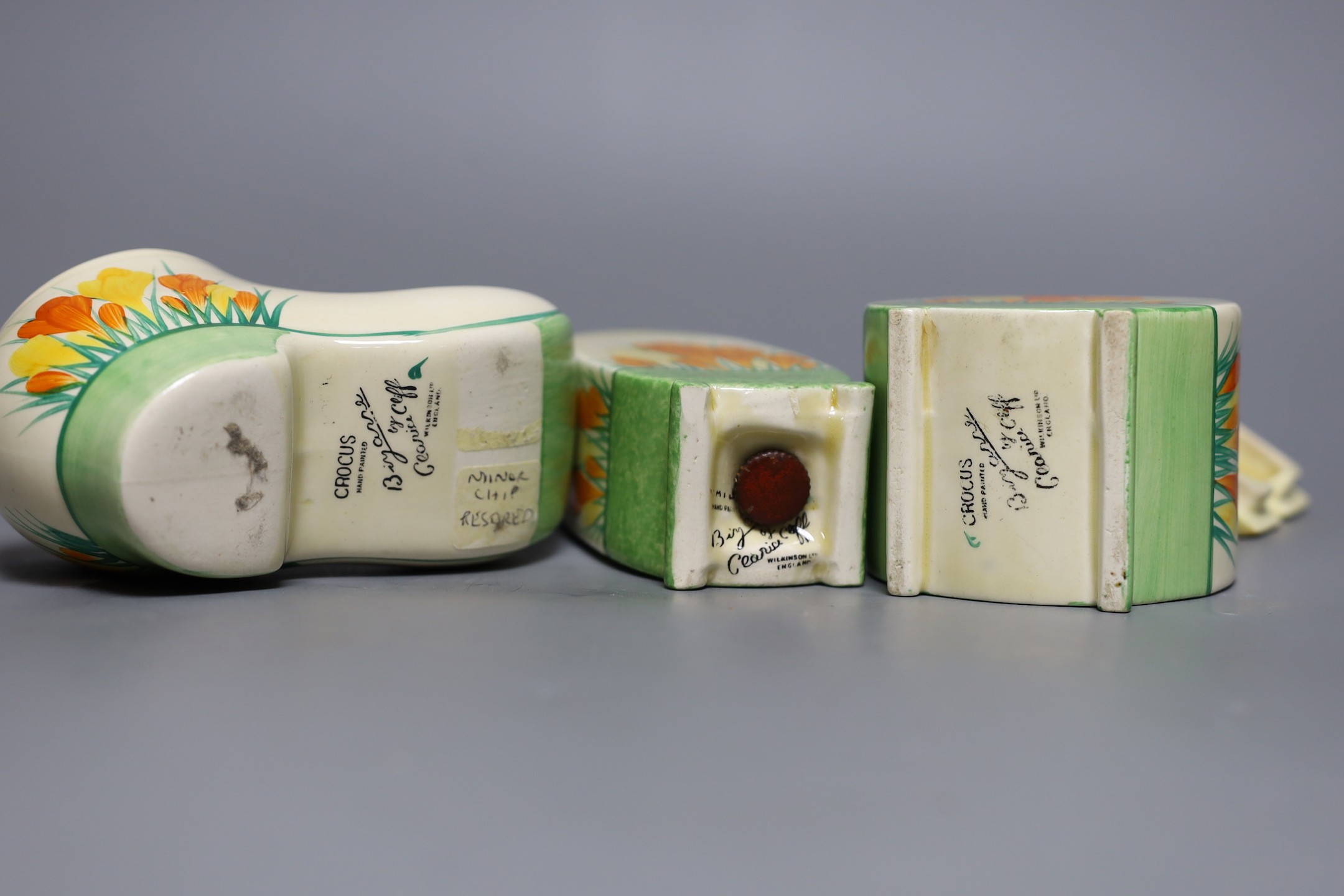 A Clarice Cliff sungleam crocus jam pot and cover, a sugar shaker and a Dutch clog ornament (3), jam pot and cover 10 cms high